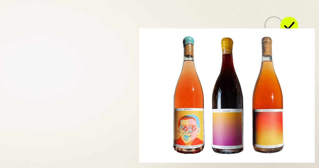 Natural Wine Sampler bottles (Monje, Jajaja, Bheeyo) on an age-verification editorial scene with a yellow check motif