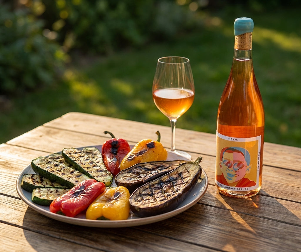 Monje skin-contact orange wine beside grilled vegetables