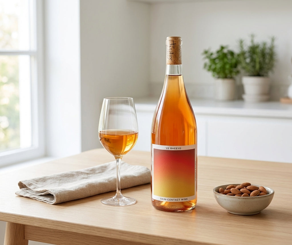 Bheeyo low-sulfite skin-contact orange wine on a bright kitchen table