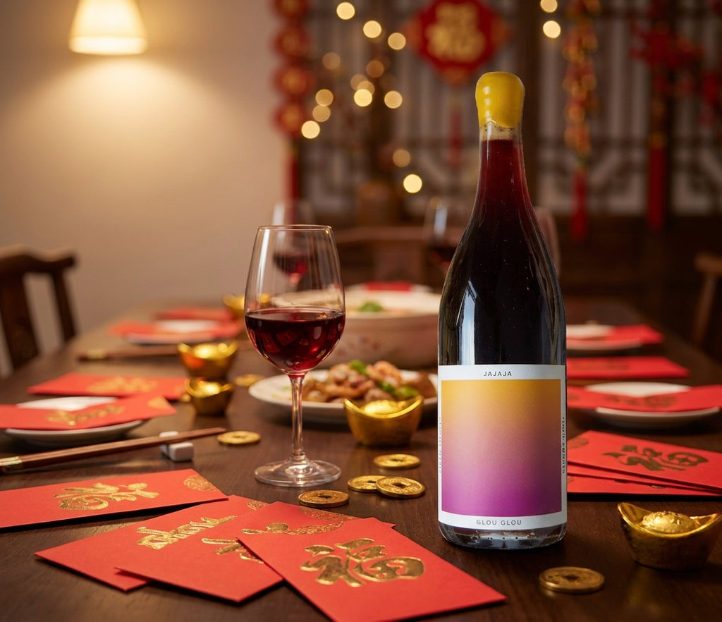 Jajaja Glou Glou red wine bottle on a Lunar New Year reunion dinner table