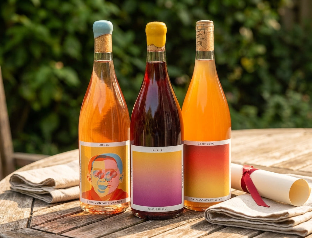 Natural Wines Sampler bottles on a graduation party patio table