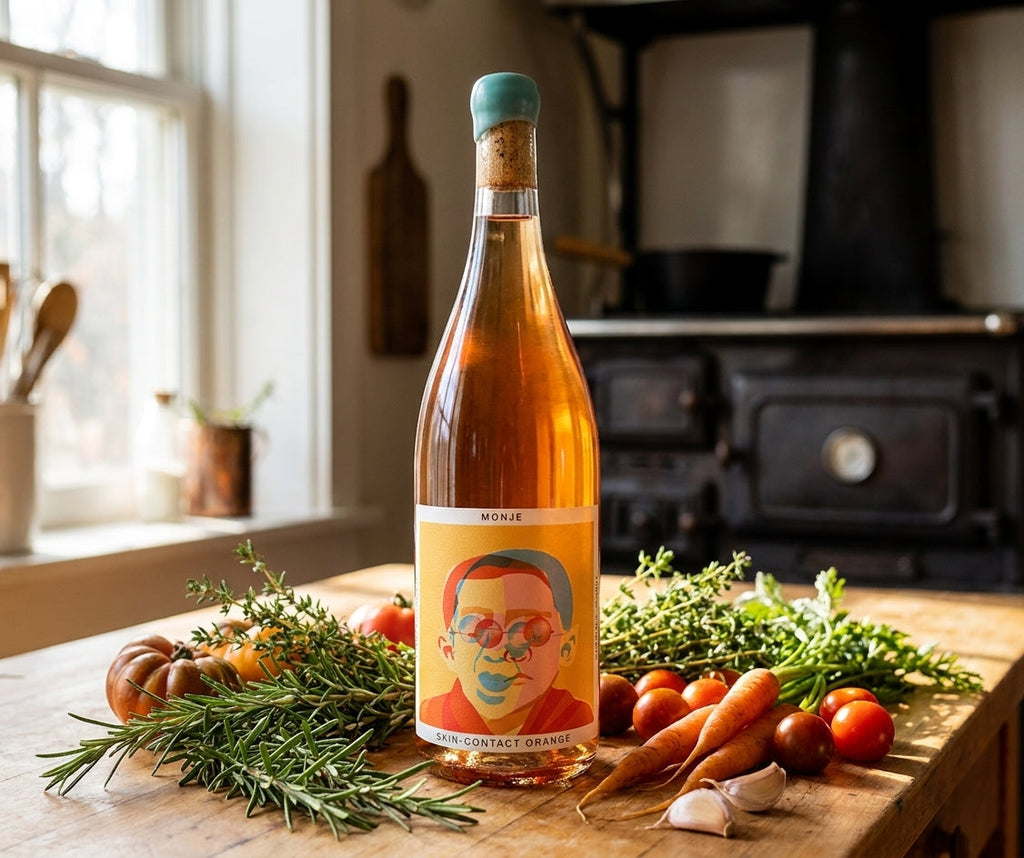 Monje skin-contact orange wine bottle on a kitchen counter with fresh meal-kit ingredients